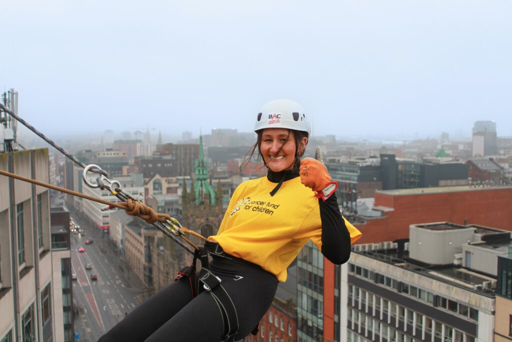 Ellie Maunsell taking on the abseil challenge at the Europa Hotel for Cancer Fund For Children