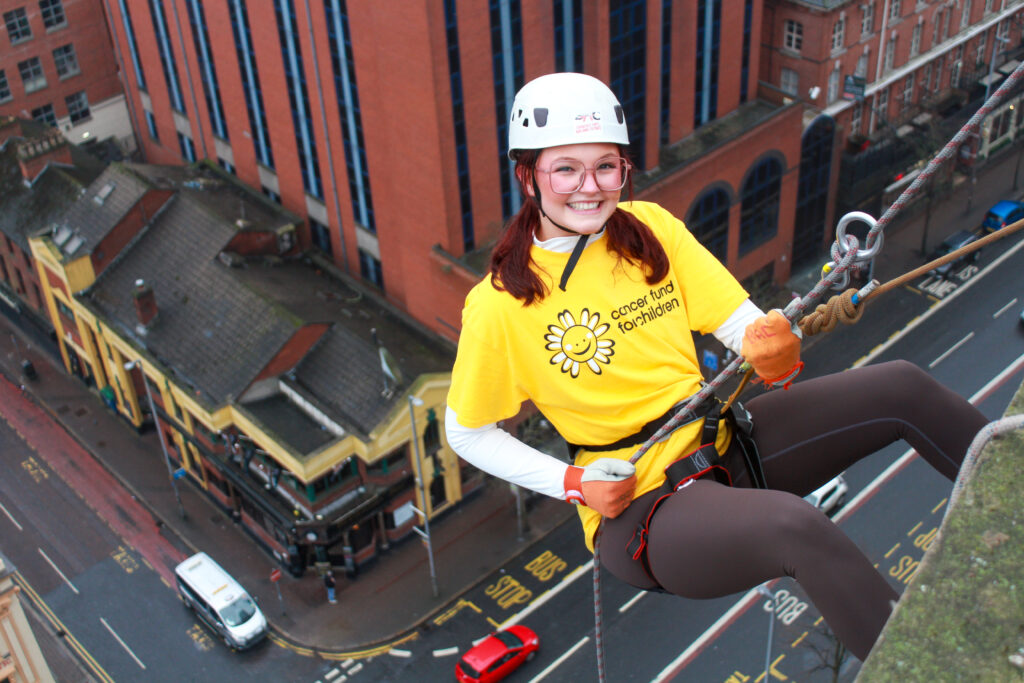 Hannah Knox taking on the abseil challenge at the Europa Hotel for Cancer Fund For Children