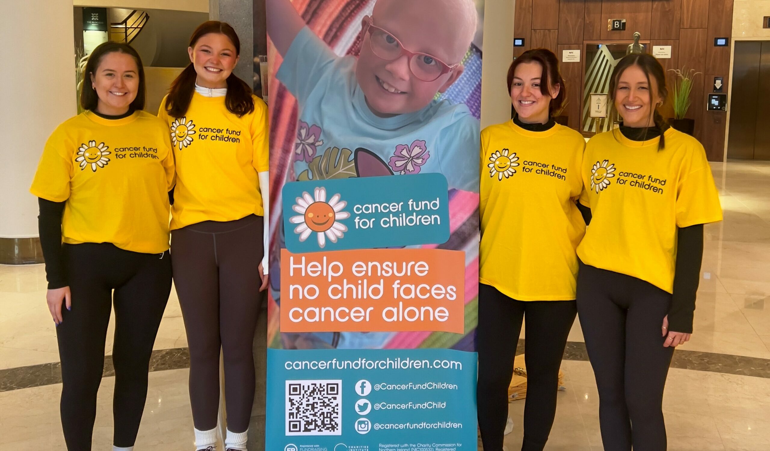 The Morrows Team, pictured left to right, Laura Magennis, Hannah Knox, Olivia Meehan and Ellie Maunsell taking on the abseil challenge at the Europa Hotel for Cancer Fund For Children